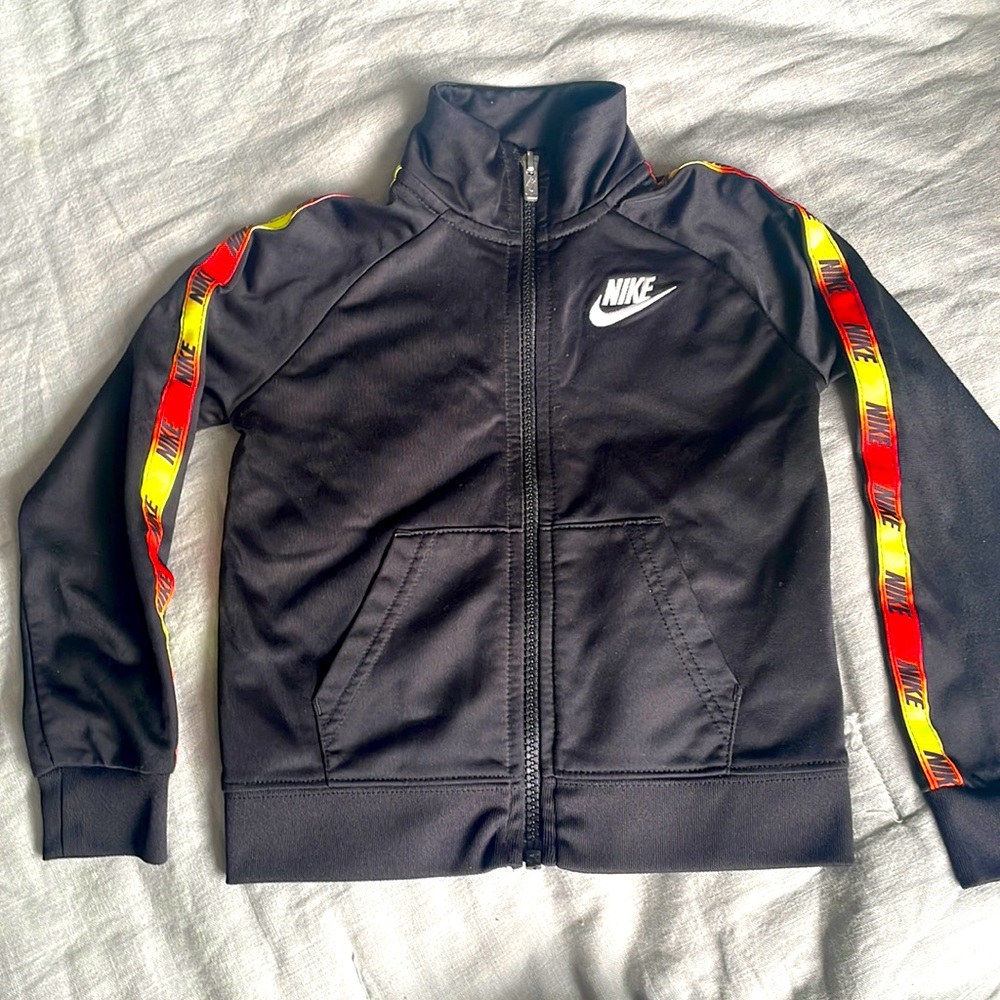 Nike Black track suit jacket with red orange yellow gradient detail